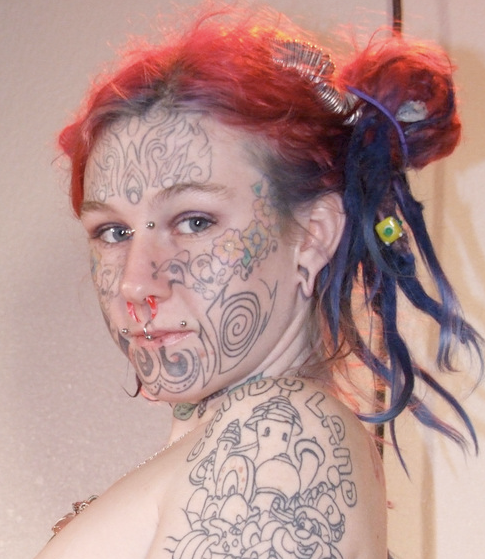I'm pretty sure I read that it's illegal to tattoo someone's face in a lot 