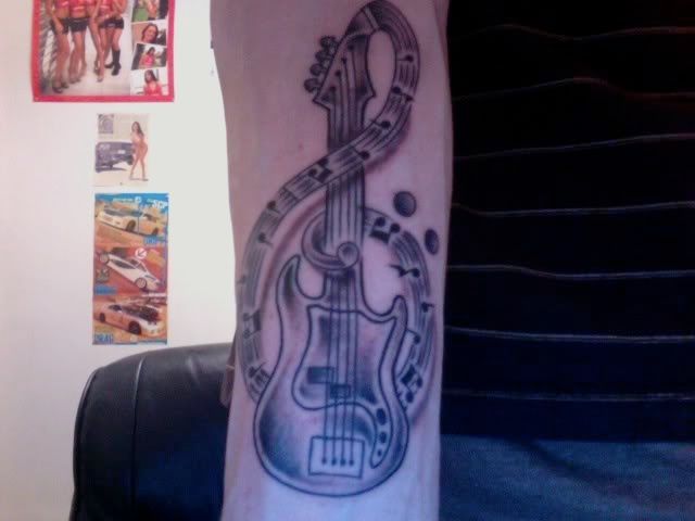 Do you guys have any tattoos that have to do with music or a band 