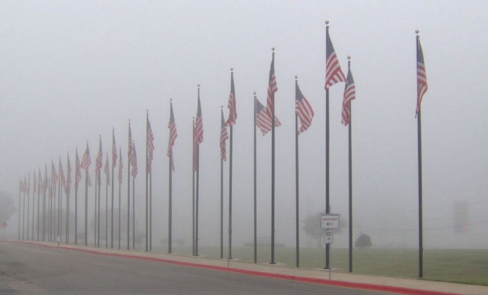 Flags in fog at Olin E. Teague VA